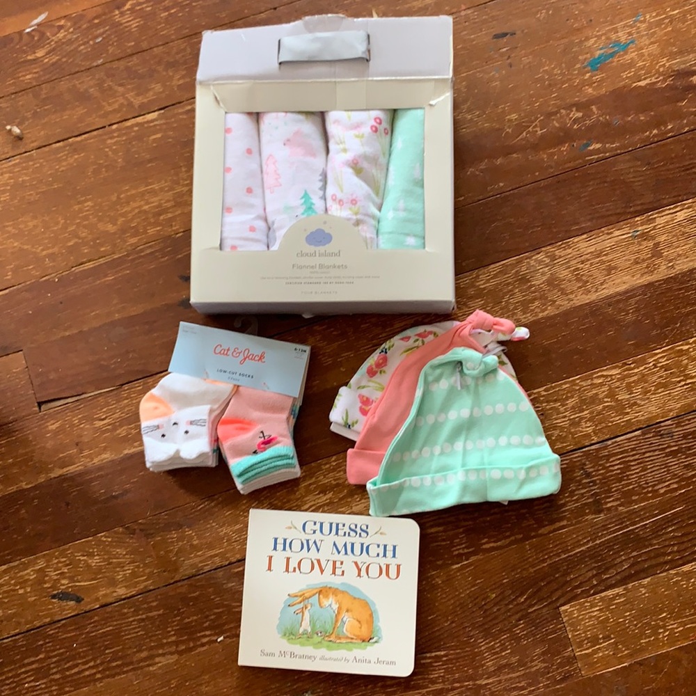 Baby stuff: book, hats, socks, blankets